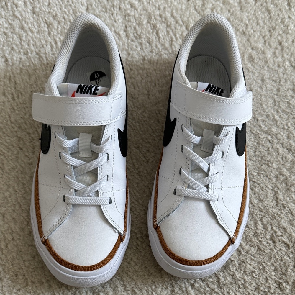Nike Kids White Sneakers with Black Swoosh and Brown Trim